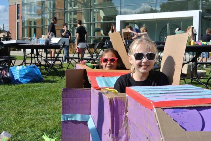 Students from St. Cecilia’s School in Pawtucket show their imagination and creativity on Sept. 28 on the Providence College campus. The school’s  entrepreneurship society hosted the event, which encouraged students to  create something out of cardboard that they could play with. The project  was inspired by Caine’s Arcade, a short film about a 9-year-old boy’s cardboard arcade in his dad’s used-auto-parts store in California. / COURTESY NICK ACKERMAN