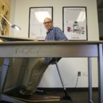 STANDING (INN)OVATION: Martin Keen, founder of Focal Upright Furniture, has debuted a line of standing workstations. The company made $1 million in sales in its first year, but is on pace for more in year two. / PBN PHOTO/MICHAEL PERSSON