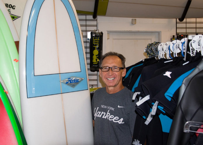 SURFS UP: Pete Pan, co-owner of Narragansett Surf and Skate, says business doubles when a hurricane is near. / PBN PHOTO/JOE MCGOVERN