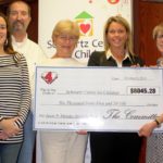 Mendes Fund gives
$6,000 to Schwartz KAREN MITCHELL, left, chairwoman of the Jason P. Mendes Fund Committee, along with Mary Hodgson, right, CEO of the Schwartz Center for Children, accept a $6,045 check from Jeff, Jeanne, and Kristen Mendes.