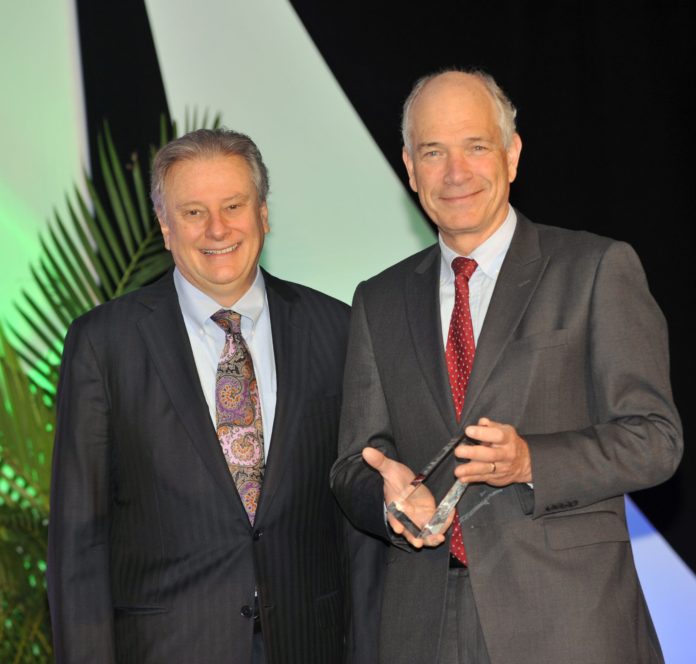 J. DONALD SCHUMACHER (left), president and CEO of the National Hospice and Palliative Care Organization, presents Vincent Mor (right) with the 2013 Distinguished Researcher Award. / COURTESY HOME & HOSPICE CARE OF RHODE ISLAND