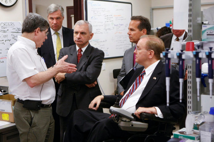 R.I.’S CONGRESSIONAL DELEGATION meets with iCubed’s Dr. Alan L. Rothman for the announcement of a grant to study Dengue Fever. From left: Rothman, U.S. Sens. Sheldon Whitehouse and Jack Reed and U.S. Reps. David N. Cicilline and James R. Langevin. / COURTESY URI