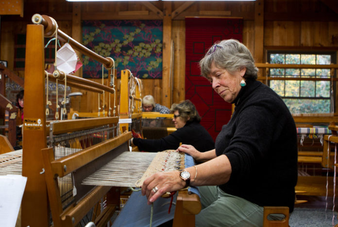 WEAVE JUST BEGUN: Sylvia Kilgour of North Easton, Mass., works a loom at the Saunderstown Weaving School. Enrollment at the school has grown to the point where it has a waiting list. / PBN PHOTO/KATE WHITNEY LUCEY