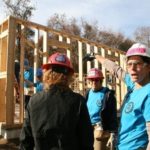 NAILING IT: Laura Reed, forewoman for the all-women construction crew building a house for Habitat for Humanity in South Kingstown, gestures while talking to crew members Carol O&rsquo;Donnell, foreground left, and Christine Fitzpatrick, center. / PBN PHOTO/MICHAEL PERSSON