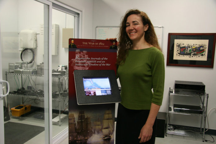 FLOODING THE MARKET: Diana Coderre, co-owner of The Digital Ark, says the company began work with the U.S. Naval War College with the preservation of two log books, both from 1812. It’s part of a long-term collaboration to develop the Naval Historical Collection website. / PBN PHOTO/MICHAEL PERSSON