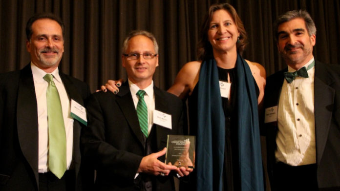 THE NANOSTEEL CO., a Providence-based developer of nano-structured steel materials for the auto industry, received the New England Clean Energy Council's Green Tie Gala award for Emerging Company of the Year. From left to right, Mitch Tyson, NECEC board chair; Robert Marini, NanoSteel vice president of finance; Ellen Bossert, NanoSteel chief marketing officer; and Peter Rothstein, NECEC president. / COURTESY NEW ENGLAND CLEAN ENERGY COUNCIL