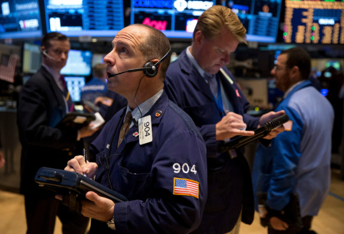 BOTH THE DOW JONES INDUSTRIAL AVERAGE and the Standard & Poor's 500 Index breached record levels Monday morning, breaking through 16,000 and 1,800, respectively, as many investors fully considered what effect the economic reforms proposed by China will do for future growth. / BLOOMBERG NEWS FILE PHOTO/SCOTT EELLS