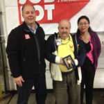 FROM LEFT: David Sarlitto, head of marketing for Ocean State Job Lot; Dan Aurelio holding a picture of his wife and daughter; and Kerstin Uy-Berja, a Johnston resident, representing His Presence Church International in Woonsocket. / COURTESY OCEAN STATE JOB LOT