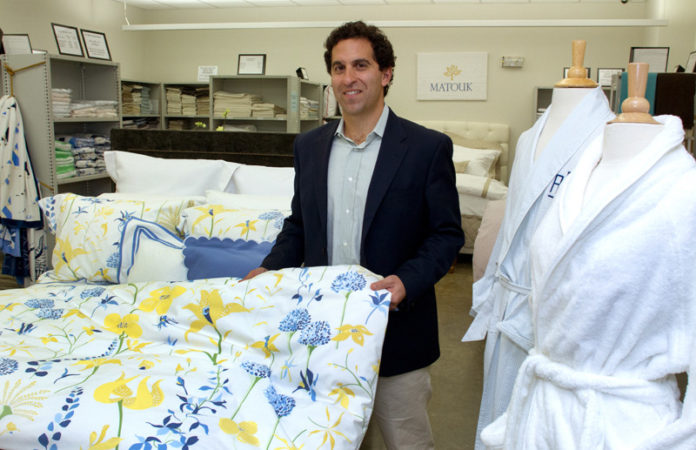 A FINE HAND: George Matouk Jr. has reinvented the firm his grandfather founded and turned John Matouk & Co. into a globally competitive, high-end manufacturer and embroider of bed and table linens, among other things. / PBN PHOTO/KATE WHITLEY LUCEY