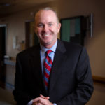 HOT HAND: Lifespan CEO Dr. Timothy J. Babineau holds the reins of an organization that is upending its business model, with demands for new approaches to health care delivery that are disrupting the revenue that the health care system had come to count on. / PBN PHOTO/STEPHANIE ALVAREZ EWENS