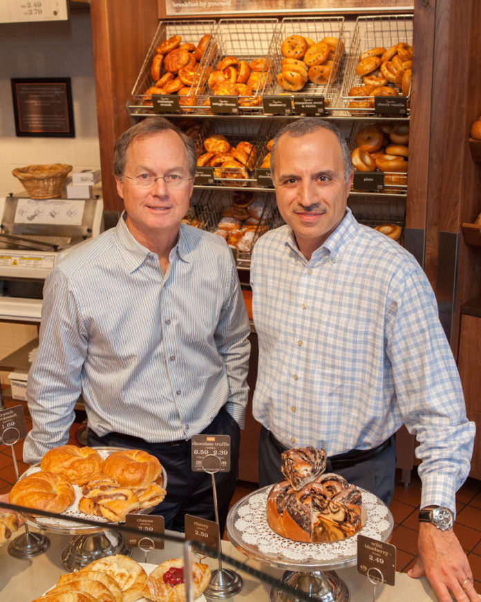 BAKED-IN SUCCESS: Tom Howley, left, and Bahjat Shariff, both senior vice presidents at Panera Bread/Howley Bread Group, along with Howley’s brother Lee, company president, have used the opportunity presented by a Panera Bread franchise in the region to grow a successful, and still expanding, business. / PBN PHOTO/TRACY JENKINS