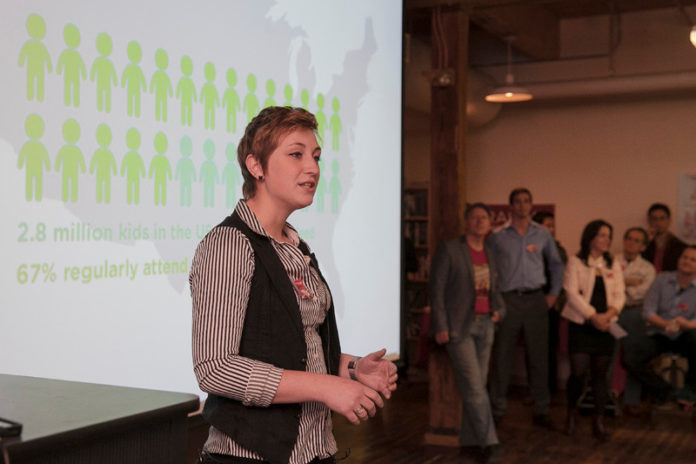 Maeve Jopson, co-founder of Increment, speaks during the Nov. 14 Launch Day for Betaspring’s fall 2013 graduating cohort of startups. Jopson and Cynthia Poon, her co-founding partner of the toy-design studio, were part of a new “maker fellow” program. The program is designed to provide mentoring and other resources to companies producing physical products, helping them bring products to market faster. At the end of each 12-week session, Betaspring celebrates the completion of its intensive startup-accelerator season. / PBN PHOTO/DAVID LEVESQUE