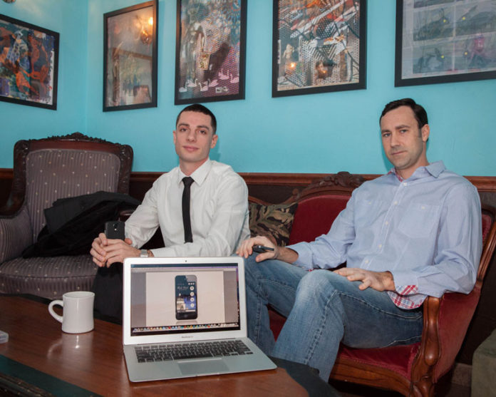 TALKING SHOP: Ely Beckman, left, principal founder of Reckoner Group, with Ethan Tucker, owner of Mobile Life Inc. Beckman and Tucker have been working together, meeting at Angelina’s Coffee Shop in Bristol. / PBN PHOTO/TRACY JENKINS