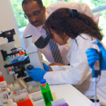 Disease study gets $15M boost SCIENTIFIC METHOD: University of Rhode Island professor and Interdisciplinary Neuroscience Program Director Nassar Zawia works with a student. / COURTESY URI/GIBLIN & CO. PHOTOGRAPHY