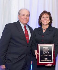 Barbara Cottam accepts the Community Involvement Award for Citizens Bank from PBN Editor Mark Murphy / Rupert Whiteley