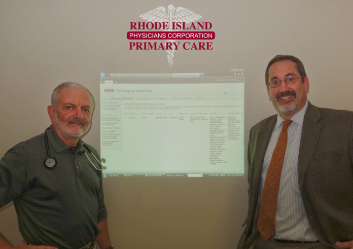 KEEPING TABS: Dr. Albert Puerini, left, CEO and president, Rhode Island Primary Care Physician Corp., and Noah Benedict, chief operating officer at the corporation, with the database. / COURTESY RHODE ISLAND  PRIMARY CARE PHYSICIAN CORP.