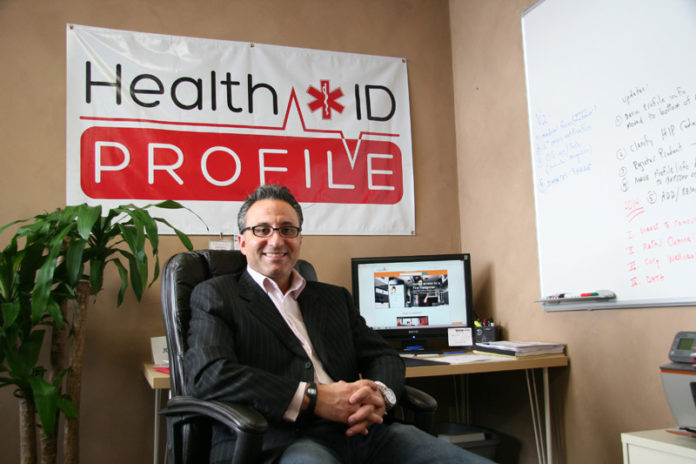When Angelo Pitassi Jr.’s son, Angelo III, was diagnosed with diabetes in 2006, he began wearing a medical bracelet that over the next few years was frequently replaced after wearing out. Pitassi became convinced he could make a better, less costly bracelet. His Providence company, HealthID Profile Inc., was formed in 2011 and today focuses on utilizing technology to store and share data on the bracelets online. “The physical products are a conduit,” he said. “The true value is what is stored in the cloud and accessed from an app.” / PBN PHOTO/MICHAEL PERSSON
