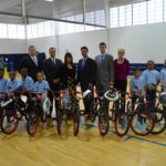 FROM LEFT: Joseph Kotula, Ed Pelletier, Erin Foley, Nicholas DiLello, Jr., Andrew Pelletier, and Donna Ricci from Barnum Financial Group, an office of MetLife, stand with students from The Grace School at Meeting Street. Students recently received donated bicycles from the friends of Foundation for Life Inc.