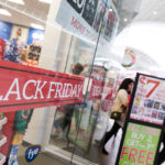 MUSIC TO THEIR EARS: Black Friday foot traffic at Warwick Mall was brisk, with retailers including FYE offering promotions attempting to lure shoppers. / PBN PHOTO/DAVID LEVESQUE