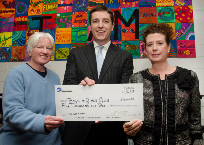 KEVIN HENNESSEY, director of federal, state & local affairs for Dominion, center. presents a check to Mary Morgan, grants manager, Boys & Girls Clubs of Providence, left, and Nicole Dufresne, executive director, Boys & Girls Clubs of Providence, right, in support of the club’s Mechatronics program.