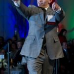 SCOTT DAMIANO of Hyatt Regency Newport, excitedly accepts his award for Hotel Employee of the Year. / COURTESY RHODE ISLAND HOSPITALITY ASSOCIATION/RICHARD KIZIRIAN