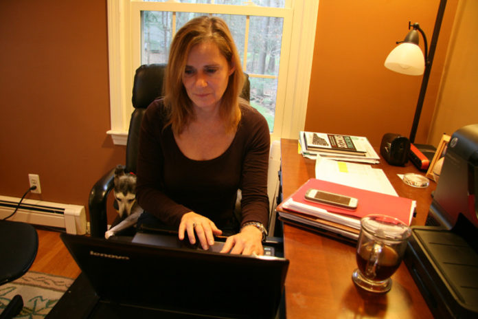 HOME BASE: NetCenergy Human Resouce Manager Margie Ahearn works from her North Easton, Mass., home. / PBN PHOTO/MICHAEL PERSSON