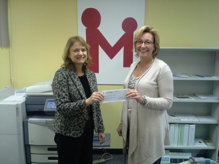 COASTWAY COMMUNITY BANK Vice President of Sales and Marketing Brenda  Forsyth, left, presents a check for $5,000 from the Coastway Cares Charitable Foundation to Rhode Island Mentoring Partnership President and CEO Jo-Ann Schofield.