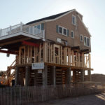 Rising above tide in Westerly ABOVE THE FRAY: A year after the remnants of Superstorm Sandy hit Rhode Island, Marcus McPhee’s house at 109 Atlantic Ave. in Westerly has been raised. / PBN PHOTO/BRIAN MCDONALD