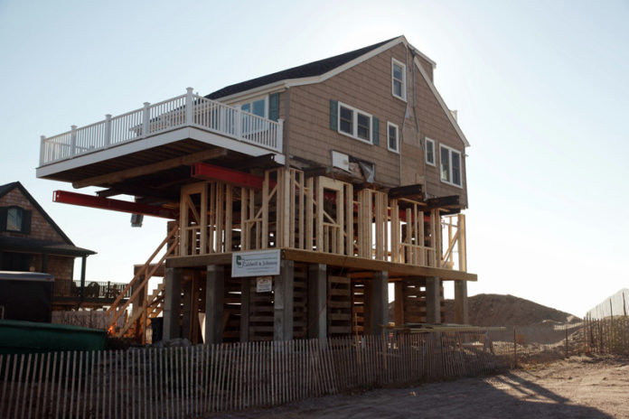 ABOVE THE FRAY: A year after the remnants of Superstorm Sandy hit Rhode Island, Marcus McPhee’s house at 109 Atlantic Ave. in Westerly has been raised. / PBN PHOTO/BRIAN MCDONALD