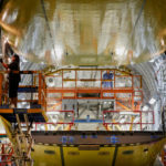 Production gain shows U.S. factories will spur growth FACTORY PRODUCTION increased 0.6 percent in November, following a 0.5 percent gain in October, in the United States, as U.S. manufacturers built momentum that seems likely to affect the Federal Reserves decision as to when to end its bond-buying program that has been helping the economy weather the effects of the Great Recession. Here, Boeing employees work in the cargo bay of a Boeing Co. C-17 Globemaster III military cargo jet being built in Long Beach, Calif. / BLOOMBERG NEWS PHOTO/PATRICK T. FALLON