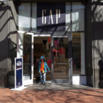 A customer exits a Gap Inc. store in San Francisco. Gap Inc. was among several apparel retail chains that lured shoppers with discounts as steep as 75 percent to boost holiday sales. On Thursday, SpendingPulse reported retail sales rose 3.5 percent during the holiday season compared with last year. / BLOOMBERG FILE PHOTO/DAVID PAUL MORRIS