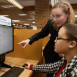 Job-hunt site names Providence among top cities for flexible jobs PROVIDENCE OFFERS AMONG the highest number of jobs in the top 10 "flexible" career fields, FlexJobs.com said Thursday. Above, Corrie MacDonald, a librarian at the Cranston Public Library on Sockanossett Cross Road, helps Meury Inirio (seated) search for a job. / PBN FILE PHOTO/DAVID LEVESQUE