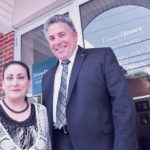 A FLEXIBLE SUPPORT SYSTEM: Edward Jones helps its financial advisers and branch administrators maintain a work-life balance while creating financial incentives for success. Pictured are Deborah Case, senior branch administrator, and Steven Grasso, financial adviser, in the Edward Jones office in Cranston. / PBN PHOTO/FRANK MULLIN