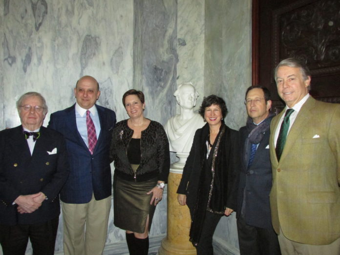 SHARING THE BILLIARDS ROOM at The Breakers with a bust of Commodore Cornelius Vanderbilt are the donors who helped the Preservation Society of Newport County purchase the sculpture and another bust of his grandson for permanent display at the mansion. From left, Eugene B. Roberts Jr., Nicholas and Shelly Schorsch, Elizabeth and William Kahane, and Preservation Society  Board Chairman Donald O. Ross. / COURTESY PRESERVATION SOCIETY OF NEWPORT COUNTY