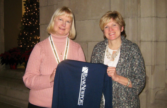 NEWPORT HOSPITAL Chief Development Officer Lianne Pinheiro, left, and BankNewport Vice President, Director of Community Relations Kathleen Charbonneau, right, display a BankNewport employee “casual day” T-shirt to signify a $450 donation that bank employees raised for Newport Hospital’s Vanderbilt Rehabilitation Center STAR Program.