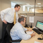 Granite’s growth fuels 2014 hiring ETCHED IN STONE: Granite Telecom-munications Branch Manager Paul Goodwin, left, with Major Accounts Manager Norman Bailey. / PBN PHOTO/TRACY JENKINS