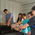 OILED UP: A team of students recycles waste cooking oil at the Westerly Transfer Station.  From left: John Perino, Vanessa Bertsch, Cassandra Lin, Miles Temel and Isaac Kaufman. / COURTESY JASON LIN
