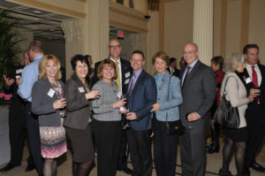 Employees from sponsor SK Wealth Management enjoy the evening  / Skorski Photography