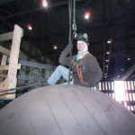 HIRE GROUND: A rigger prepares to move a large component in the high bay shop at Electric Boat&rsquo;s Quonset Point submarine manufacturing facility. / COURTESY ELECTRIC BOAT