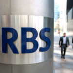 MOODY'S INVESTORS SERVICE may downgrade Royal Bank of Scotland as a result of the bank saying that full-year results would be affected by extraordinary charges and costs. / BLOOMBERG FILE PHOTO/SIMON DAWSON