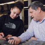 OPEN DIALOGUE: Peter Manickas, president of Metal Tile Technology, with employee Angalissa Reyes. Manickas sees value in sharing successes and failures with fellow businesses owners in the Entrepreneurial Exchange. / PBN FILE PHOTO/BRIAN MCDONALD