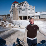 Rising above flood-insurance costs HEAD ABOVE WATER: John Tregenza, general manager of the Watch Hill Boat Yard in Westerly, says an empty ground-floor story will help protect the recently completed building in the event of flooding. The boatyard opted out of flood insurance. / PBN PHOTO/MICHAEL SALERNO