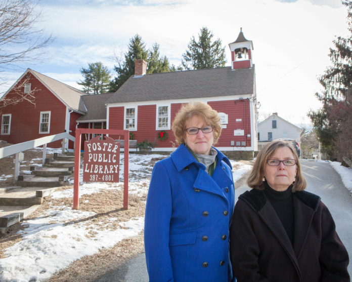 The nonprofit Libraries of Foster would get a new home under a developer’s plan to build the town’s first-ever shopping complex. The project, called Simmons Crossing, would include a new library, restaurant, grocery, small post office and other shops near the Route 6 and Route 94 intersection. Above is librarian Kristine Chin, left, and developer Ann Valentine, in front of one of the town’s two library sites, on Howard Hill Road. The town must still raise money to help build the library, estimated to cost $3 million. / PBN PHOTO/TRACY JENKINS