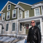 First Look targets noninvestors RAY OF HOPE: Taylor Ellis, housing development manager for House of Hope, in front of a duplex on West Street in Warwick. / PBN PHOTO/MICHAEL SALERNO