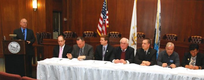 AT THE signing ceremony for the co-sponsorship agreement at Pawtucket City Hall on Feb. 3 are, left to right,  SBA Rhode Island District  Director Mark S. Hayward, SBA New England Regional Administrator Seth A. Goodall, Pawtucket Mayor Donald R. Grebien, Pawtucket Foundation Executive Director Aaron Hertzberg, President and CEO of the Northern Rhode Island Chamber of Commerce John C. Gregory,  Senior Vice President of TD Bank Frank Casale, Chair of the Joseph G.E. Knight SCORE Chapter  George Hemond and  Center for Women & Enterprise Program Manager  Carmen Diaz-Jusino. / COURTESY SBA/NORMAND T. DERAGON