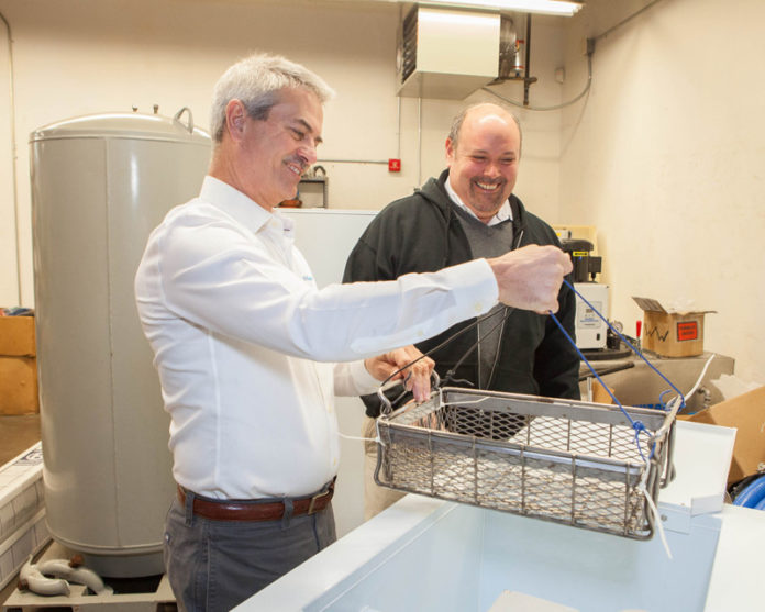 LIFE AQUATIC: Water-recycling firm AquasGroup services a variety of companies, including jewelry manufacturers, toolmakers and marinas. Pictured above are Rob Sheldon, left, vice president of sales and marketing, and Nicholas Paolo Jr., company president. / PBN PHOTO/TRACY JENKINS