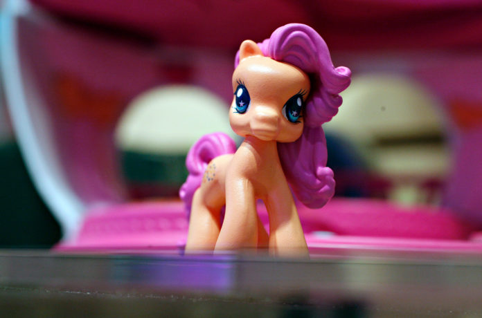 A My Little Pony Ponyville character sits on display in the Hasbro showroom during the 2007 International Toy Fair in New York. Sales of Hasbro's girl division toys, including the My Little Pony franchise, topped $1 billion for the first time in 2013. / BLOOMBERG FILE PHOTO/DANIEL ACKER