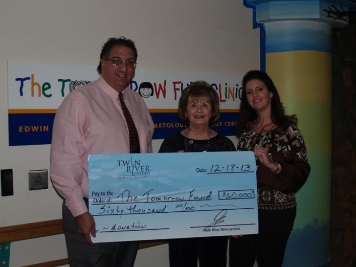 “THE YEARS of unwavering support and commitment by Twin River make our mission stronger each year,” said Barbara Ducharme, executive director of The Tomorrow Fund. From left: Craig Sculos, general manager and vice president at Twin River Casino; Ducharme and Kim Ward, director of public and community affairs at Twin River Casino.
