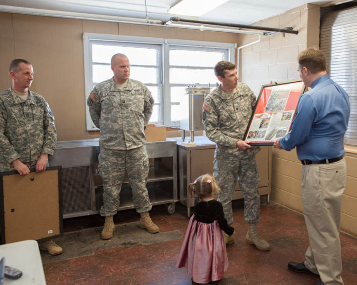 LIVING THROUGH IT: Mark Braden, far right, says that he kept reliving the damage he saw serving in the military. Also pictured from left: Sgt. David Flynn, Capt. Richard Claxton, Spc. Ray Redmond and Braden’s daughter, Bailey. / PBN PHOTO/TRACY JENKINS