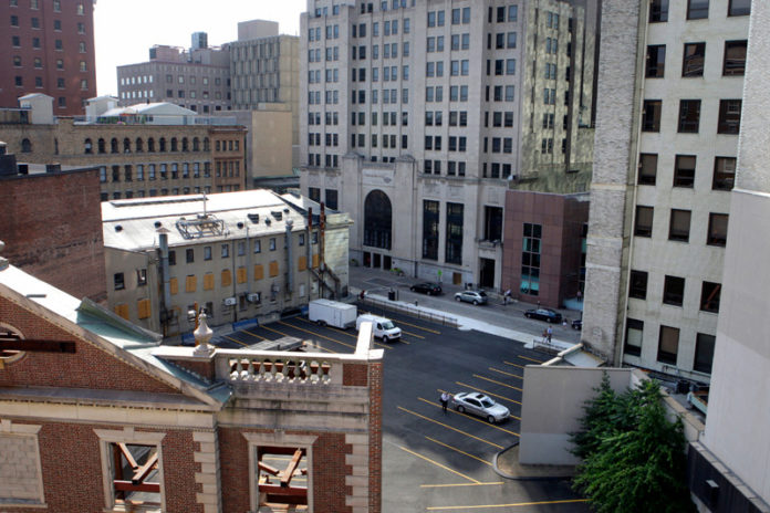 A DRAFT REWRITE of the Providence zoning code proposes lowering parking minimums for residential buildings citywide from 1.5 parking spaces per housing unit to 1 space per unit, and would allow shared parking in mixed-use areas. The ordinance would also create new transit zones with no residential parking minimum. / PBN FILE PHOTO/FRANK MULLIN